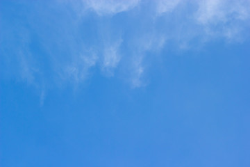 Fluffy blue sky background and white clouds soft focus, and copy space