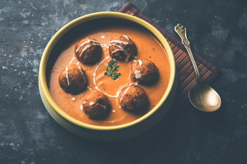 Malai Kofta Curry is a Mughlai special recipe served in a bowl. Selective focus