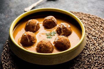 Malai Kofta Curry is a Mughlai special recipe served in a bowl. Selective focus
