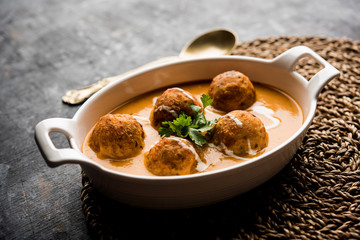Malai Kofta Curry is a Mughlai special recipe served in a bowl. Selective focus
