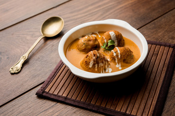 Malai Kofta Curry is a Mughlai special recipe served in a bowl. Selective focus