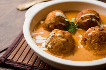 Malai Kofta Curry is a Mughlai special recipe served in a bowl. Selective focus