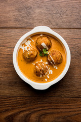 Malai Kofta Curry is a Mughlai special recipe served in a bowl. Selective focus