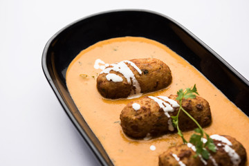 Malai Kofta Curry is a Mughlai special recipe served in a bowl. Selective focus