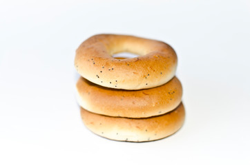 Three bagels on white background