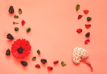 Valentines Day concept. Creative paper background of coral gerbera and hearts. Living Coral trendy color. Top view, copy space