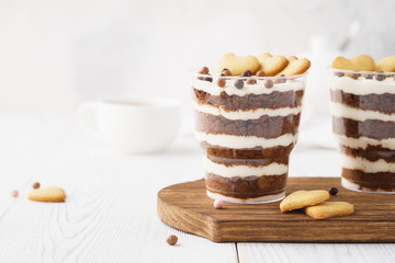 Individual desserts in glasses, chocolate trifle with hearts.