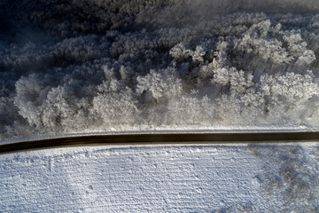 aerial drone view with road in winter season