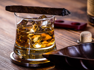 Whisky on the rocks and a cigar