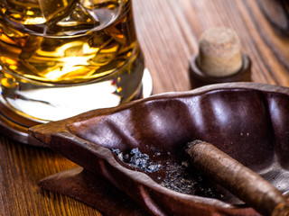 Whisky on the rocks and a cigar