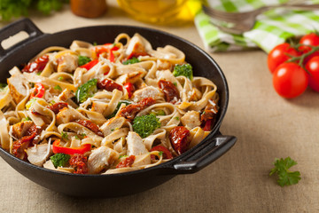 Whole-grain tagliatelle pasta with grilled chicken.
