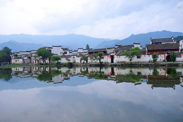 Fototapeta premium The water Reflection of Hongcun village in morning. Hongcun Village, Anhui China : one of most attractive ancient village in China.
