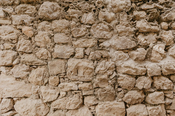 Texture of a stone wall. Old castle stone wall texture background. Stone wall as a background or texture. Part of a stone wall