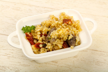 Bulgur with chicken hearts