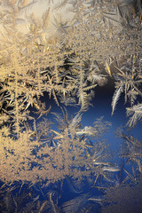Frost and ice crystals on window glass.