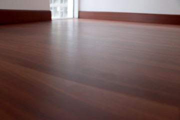 sunlight came through the windows and shone on the laminate floor