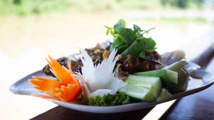 Thai food, Spicy freshwater fish In white dish.