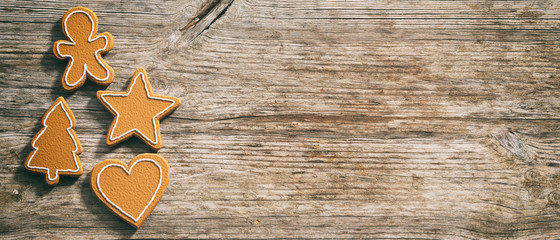 Christmas gingerbread cookies, top view, wooden background, banner