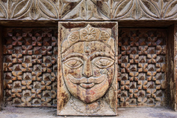 Vashisht, India - May 27, 2017: Traditional wooden carving on the hindu temple in Vashisht village in Kullu valley, Himachal Pradesh, India