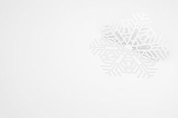 New year's eve greeting card concept. Snowflake cut from paper, casting a shadow. 3d illustration