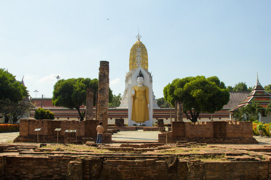 Standing Buddha Statue, Ancient buddhist Thai temple in Wat Pra sri rattana mahathat woramahavihan (Wat Yai) Phitsanulok, Thailand.