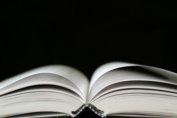 An opened book on table.