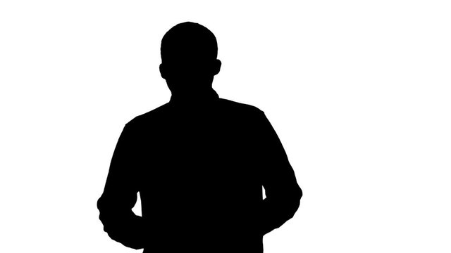Silhouette Man in casual walking and talking to the camera.