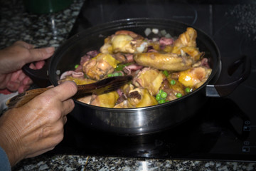 stew of meat, chicken with peas and squid