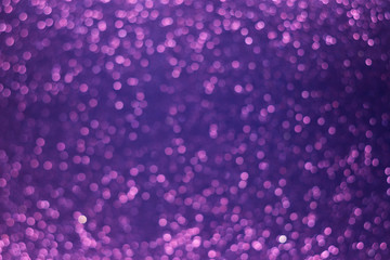 Holiday shiny purple bokeh background, glitter, sparkles, defocused glow
