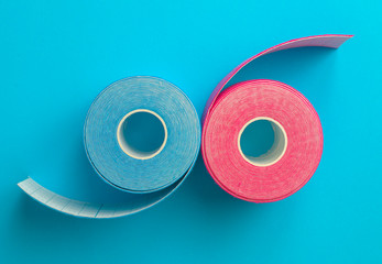 Pink and blue kinesiotape on blue background