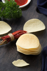 Potato chip on wood

