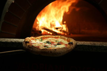 Margherita pizza near the stove