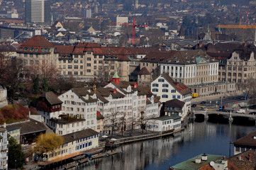 Fototapeta na wymiar Panoramic view from the Grossminster-Tower to the old town of Zürich with the limmat river boat club