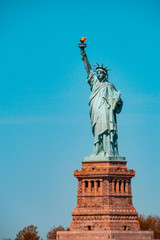 Fototapeta premium Teal and orange view of The Statue of Liberty Enlightening the World, Liberty Island, NYC
