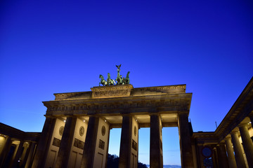 Lit Brandenburg Gate in Berlin during the blue hour.