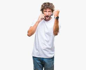 Fototapeta premium Handsome hispanic man model talking on smartphone over isolated background annoyed and frustrated shouting with anger, crazy and yelling with raised hand, anger concept