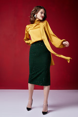 Beautiful sexy pretty woman red lipstick jewelry earrings brunette hair cosmetic makeup fashion wear clothes style beauty salon happy party style Valentine's red background accessory brunette.