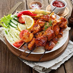 Chicken Shish kebab or shashlik, grilled meat skewers, traditional turkish dish, top view.