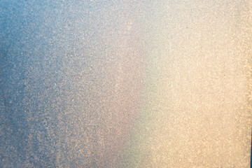 background ice, frozen window covered with frost in the sun, abstract silvery texture, gradient....