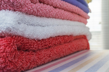 Stack of clean multi colored terry towels
