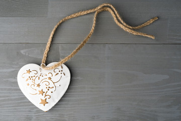 Festive heart shaped Christmas or New Year ornament with twine.