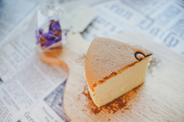 Handmade  Fluffy Japanese Cheesecake on wood Chopping board.