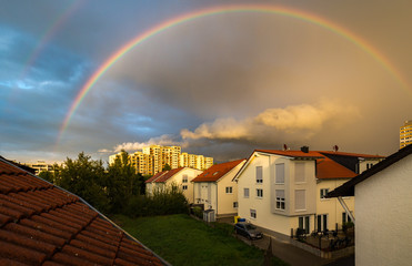 Rodgau, Germany - September 11, 2017: Glowing double rainbow during sunset, photographed through a polarizer.