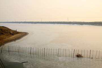 nets on the shores of an icy river
