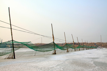nets in shores of an icy river