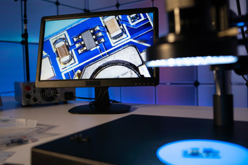 Laboratory of semiconductor chips. The development of modern electronics. crystal chip in the microscope