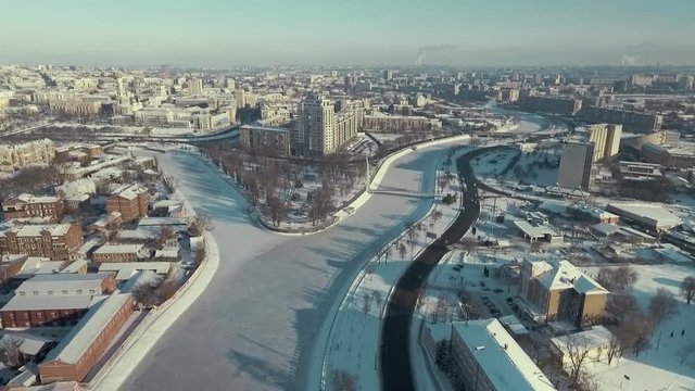 Kharkiv, Ukraine - Dec 13, 2016: Aerial of Strelka park covered with snow, river crossing, snowy winter. city landscape