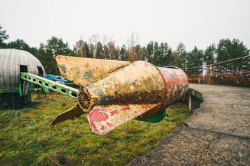 Old rocket ride carousel in abandoned amusement park