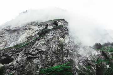 foggy mountains peaks. Mountain hiking paradise landscape. Bulgaria, Devil throat cave.