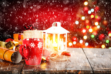 Table background of christmas time and red background with christmas tree 
